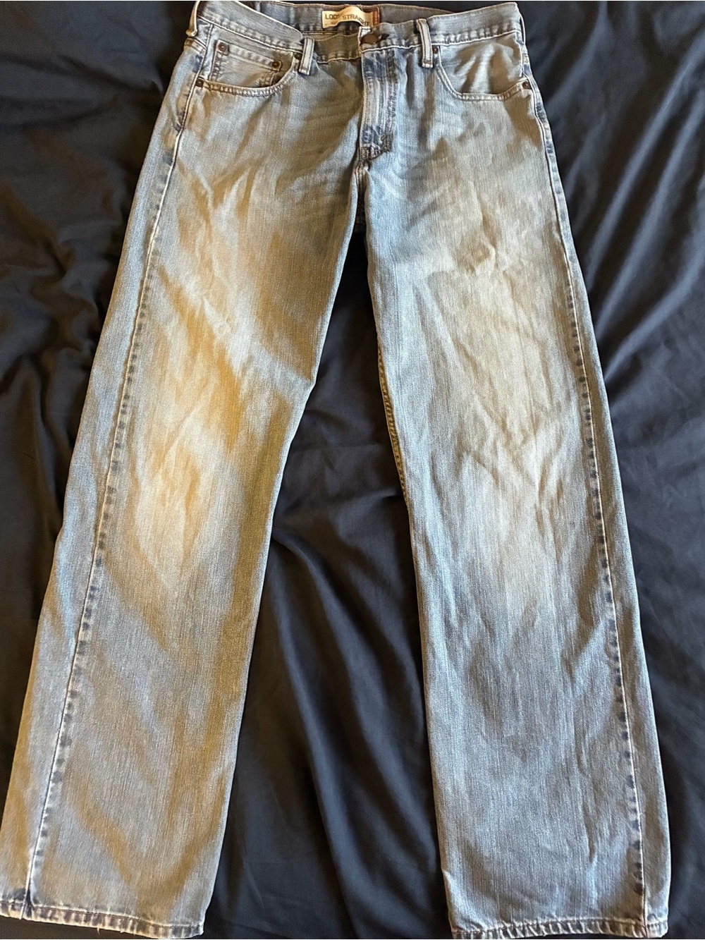 Levi's faded blue straight-leg loose fit, slightly distressed 34-36